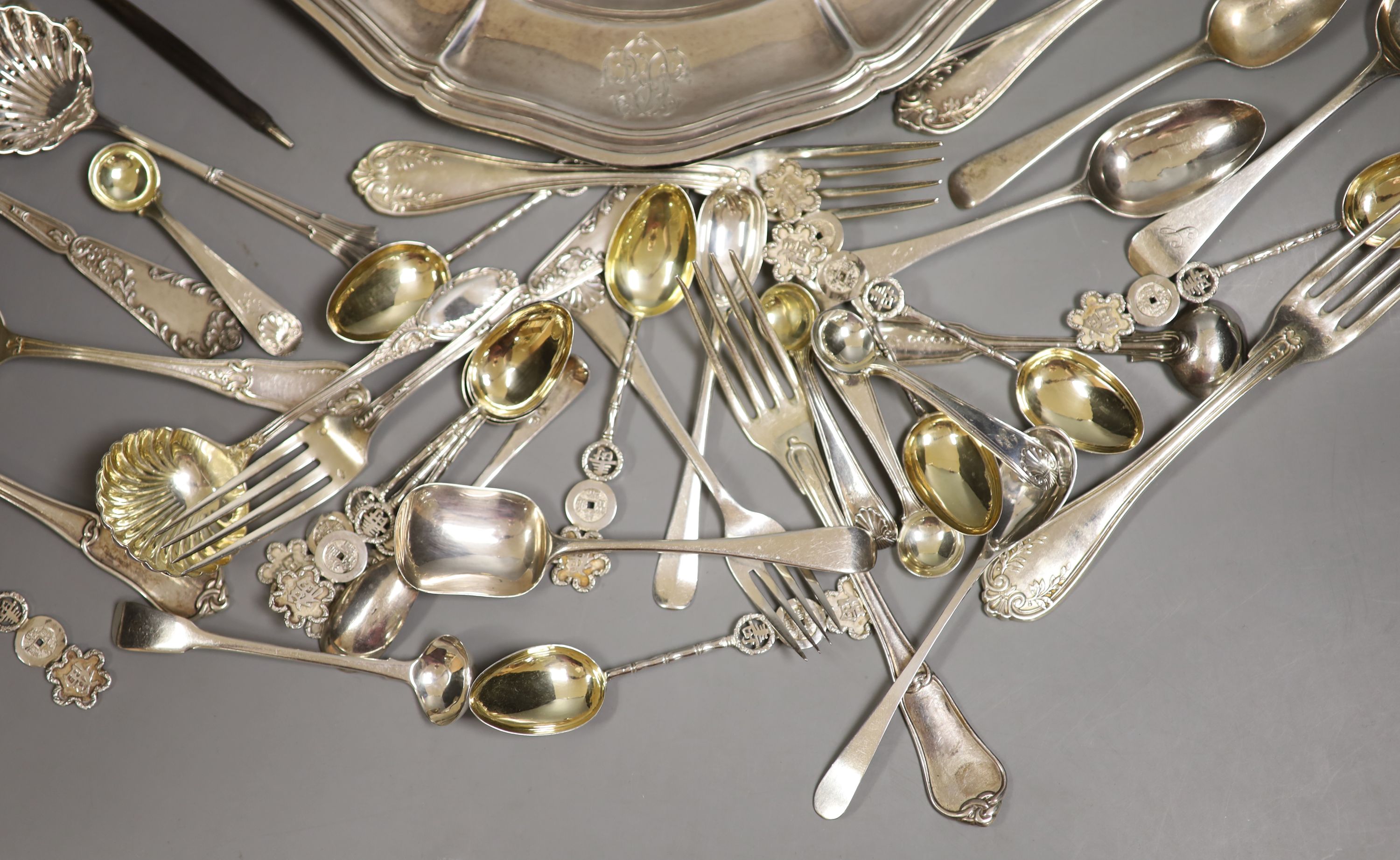 A group of assorted flatware, including some French and Chinese white metal and English silver and an Odiot 1885 white metal plate